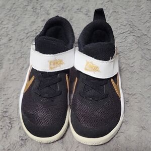Nike Kids Black and Gold Shoes
